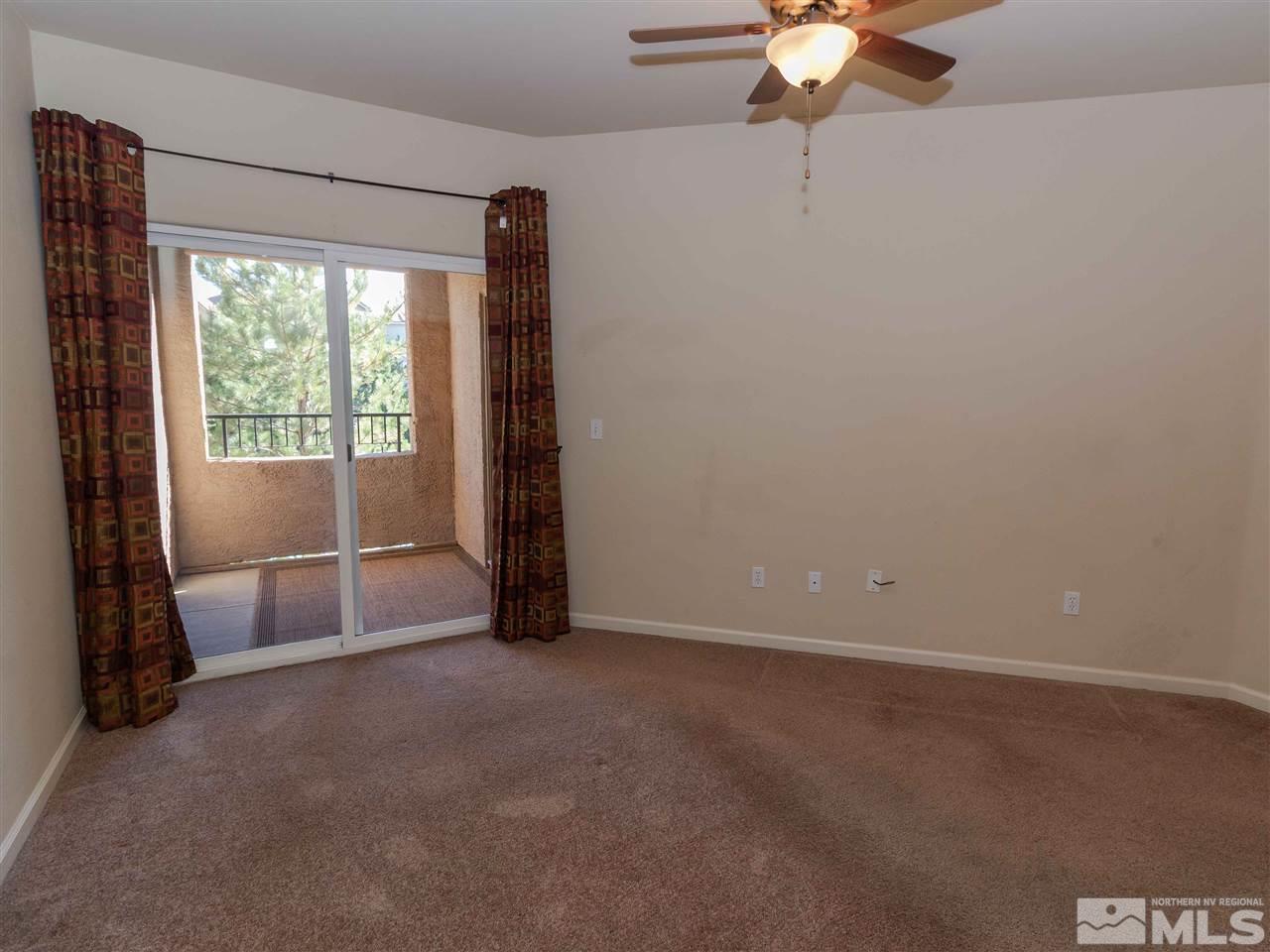 9050 Double R, Unit 1925 Reno, NV 89521 - Photo 9 of 25 an empty room with windows and fan