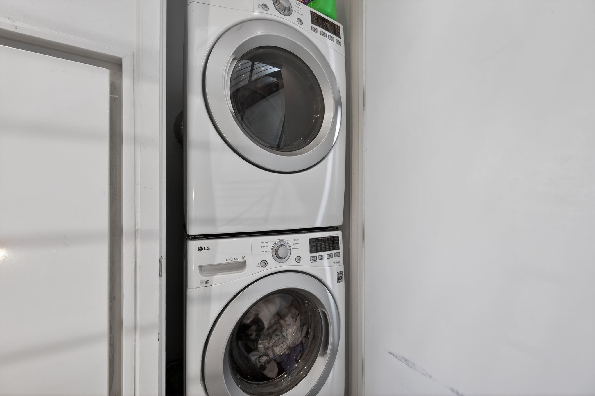 2301 South 5th Street, Unit 25 Austin, TX 78704 - Photo 23 of 35 Laundry area with stacked washing machine and dryer