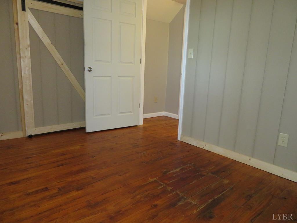2961 Cotton Patch Road Gretna, VA 24557 - Photo 12 of 24 a view of an empty room with wooden floor