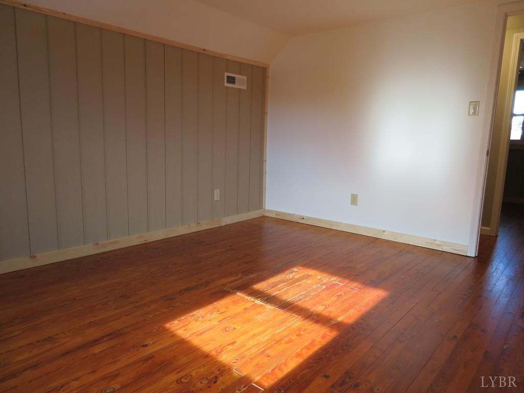 2961 Cotton Patch Road Gretna, VA 24557 - Photo 16 of 24 a view of a room with wooden floor and white walls