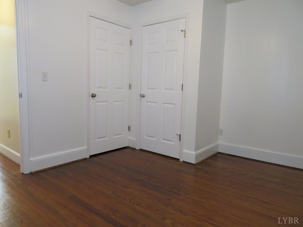 2961 Cotton Patch Road Gretna, VA 24557 - Photo 19 of 24 a view of an empty room with wooden floor