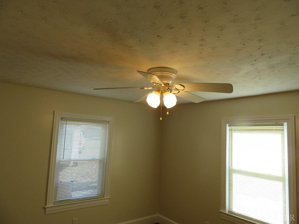 2961 Cotton Patch Road Gretna, VA 24557 - Photo 21 of 24 a view of a livingroom with a chandelier fan and a window