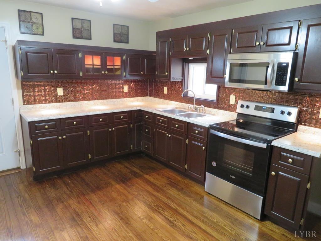 2961 Cotton Patch Road Gretna, VA 24557 - Photo 6 of 24 a kitchen with a sink and steel appliances