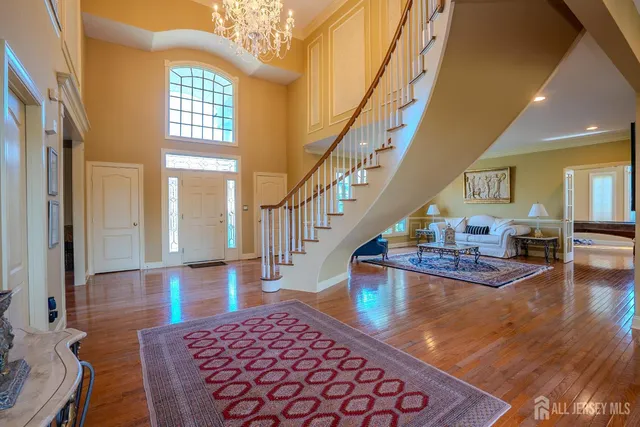 a living room with furniture a rug and a window