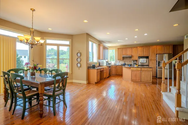 a view of entryway with wooden floor and front door