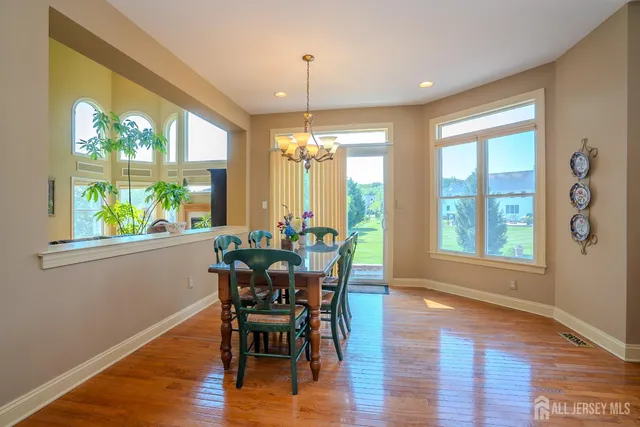 a bedroom with furniture and large windows