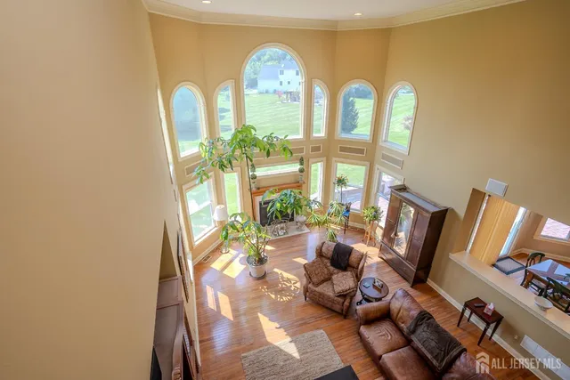 a spacious bathroom with a tub sink and mirror