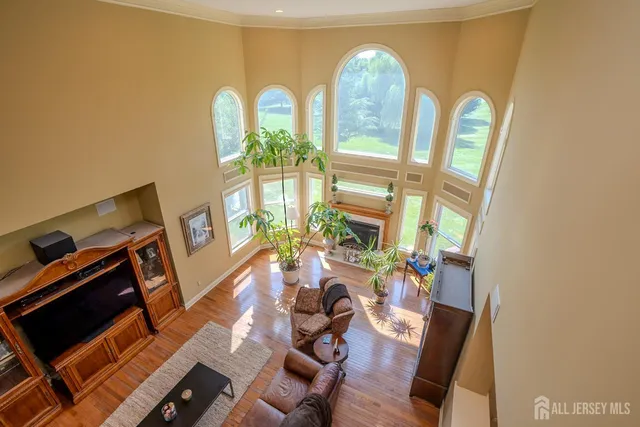 a aerial view of a house with swimming pool and a yard