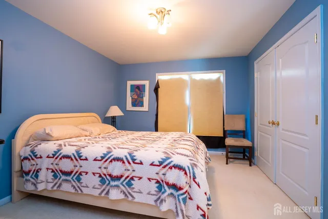 a aerial view of a house with a swimming pool lawn chairs and yard