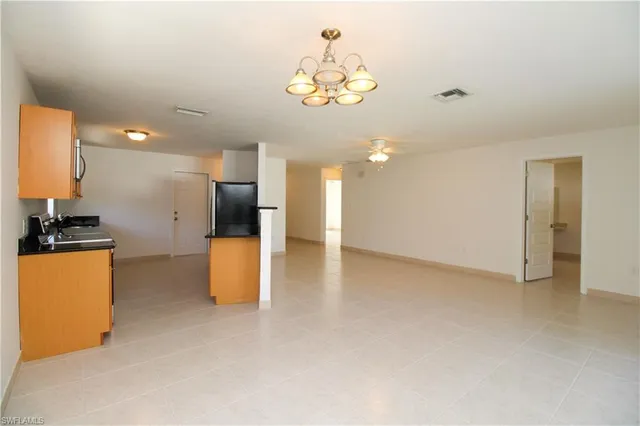 a view of kitchen and kitchen with furniture