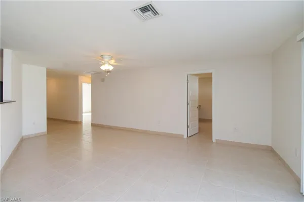 a view of an empty room with a window