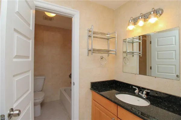 a bathroom with a toilet and a sink