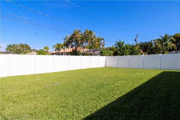 a view of a backyard with a garden and plants