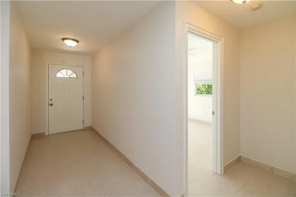 a view of an empty room and window