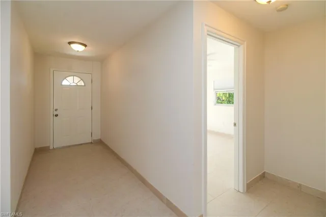 a view of an empty room and window