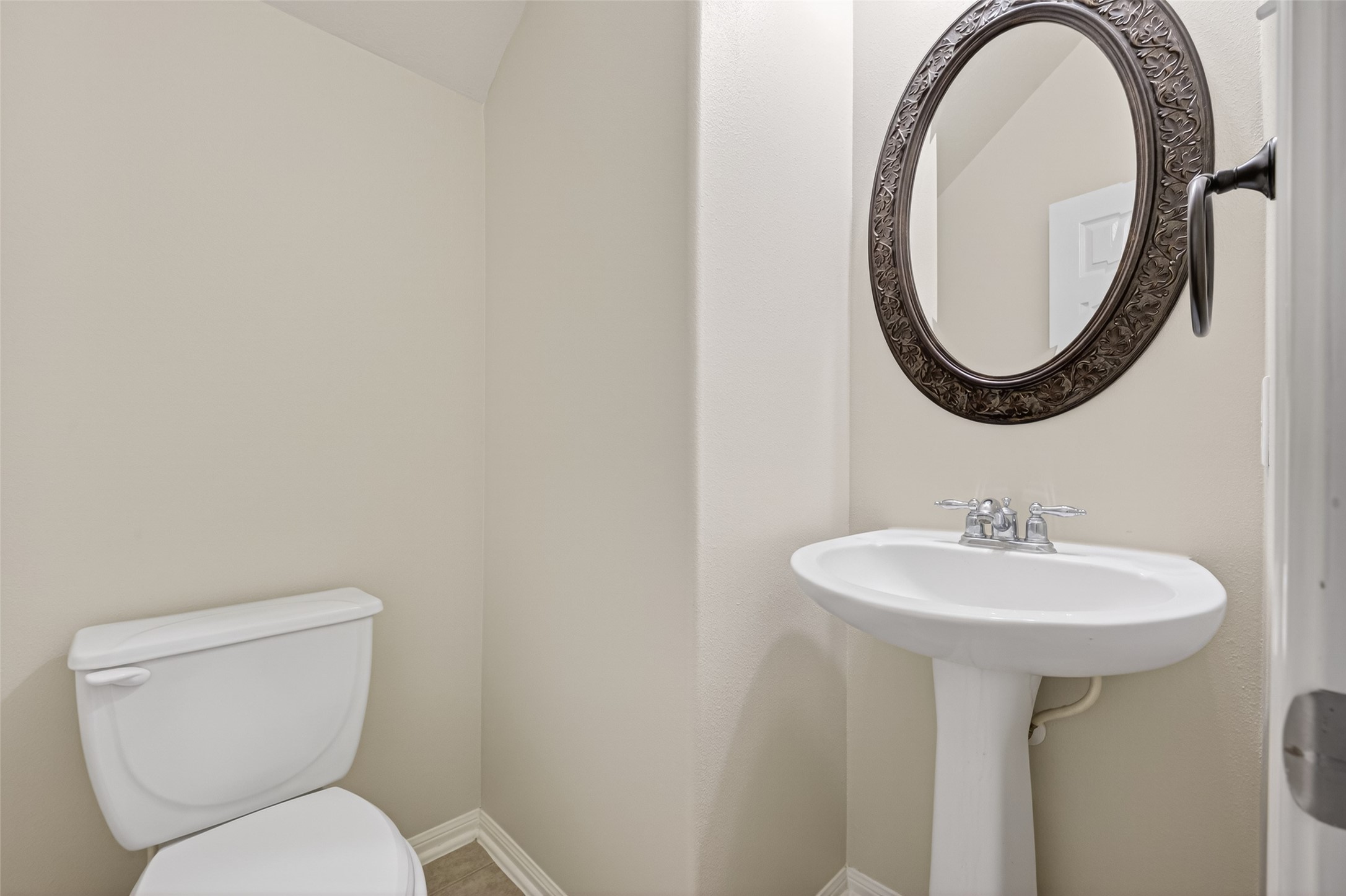 3219 Legends Mist Drive Spring, TX 77386 - Photo 19 of 37 a bathroom with a toilet sink and mirror