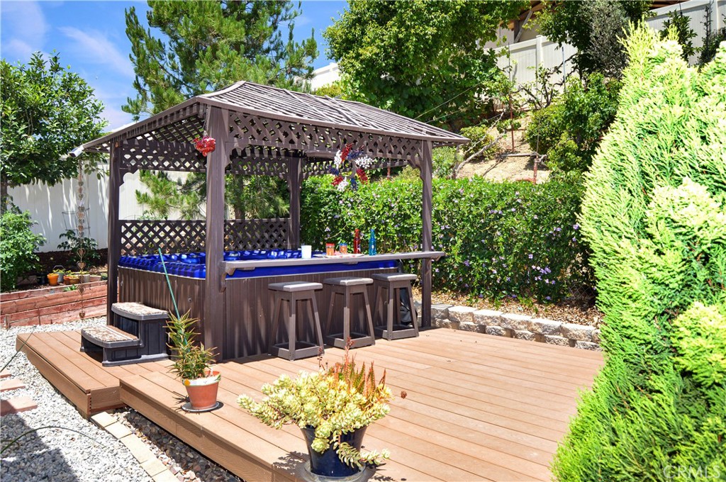 166 Fox Lane Calimesa, CA 92320 - Photo 63 of 76 Approx. 1/4-Acre Lot with Above-Ground Spa, Gazebo, Decking, Covered Patio with 3 Fans and Extra Shaded Sections, Dog Run, 3 Sheds, Fruit Trees, Grape Vines, Vegetable Garden, Bed of Irises Almost Ready to Bloom, and Gated RV Parking
