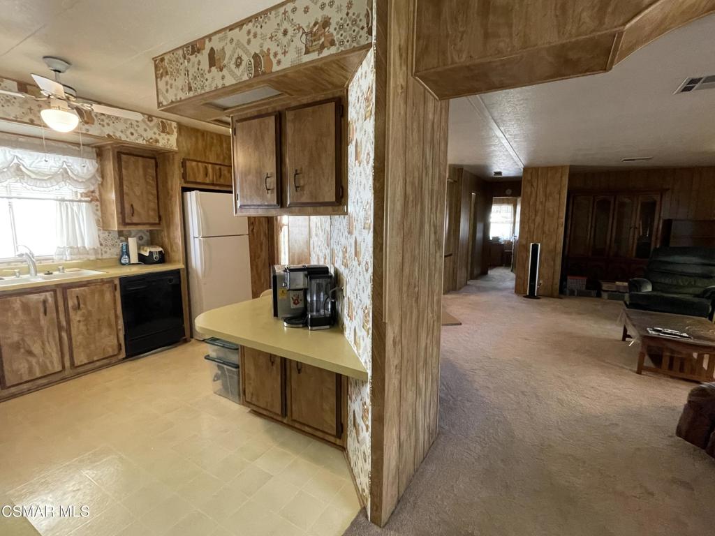 6480 Katherine Road, Unit 79 Simi Valley, CA 93063 - Photo 15 of 40 a kitchen with stainless steel appliances a stove a refrigerator and a sink