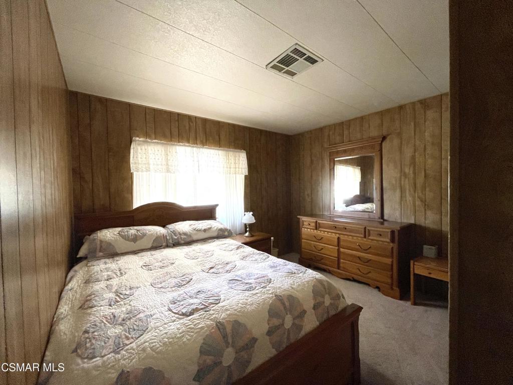 6480 Katherine Road, Unit 79 Simi Valley, CA 93063 - Photo 16 of 40 a bedroom with a bed and a dresser