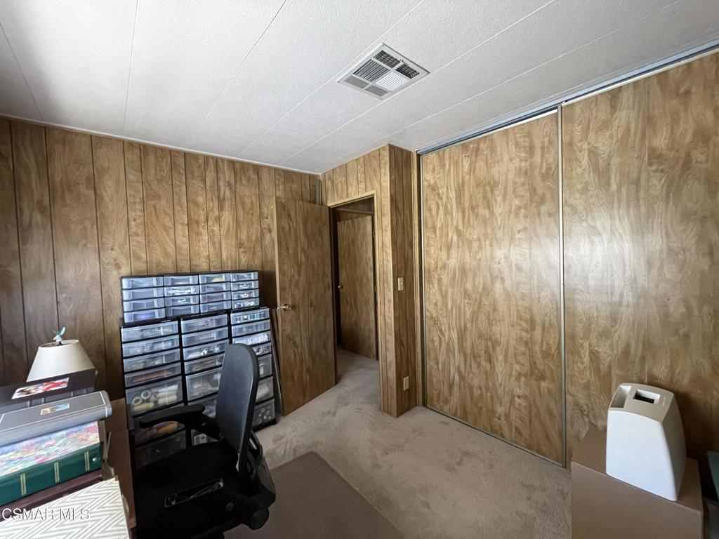 6480 Katherine Road, Unit 79 Simi Valley, CA 93063 - Photo 18 of 40 a view of a hallway with stairs and furniture