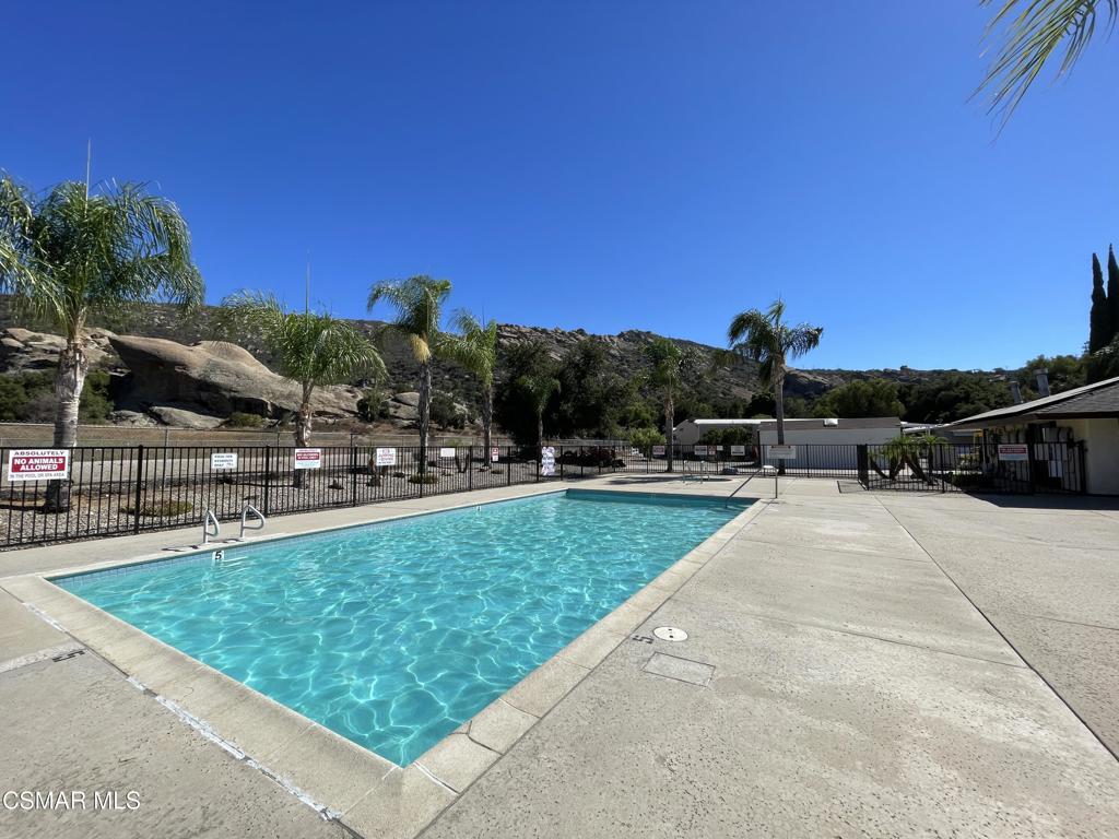 6480 Katherine Road, Unit 79 Simi Valley, CA 93063 - Photo 26 of 40 a view of swimming pool from a lounge chair