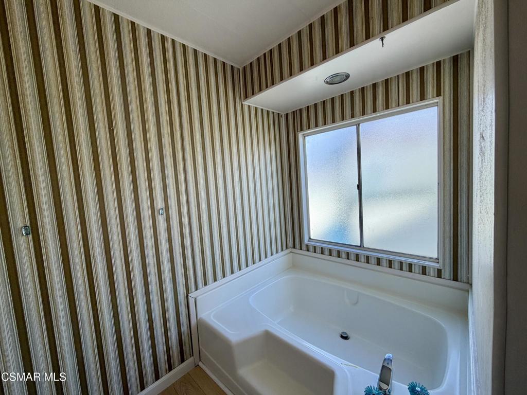 6480 Katherine Road, Unit 79 Simi Valley, CA 93063 - Photo 27 of 40 a bathroom with a bathtub and a shower