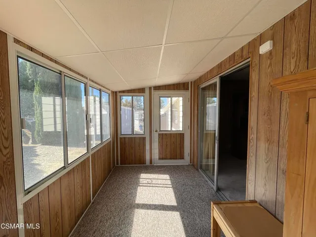 a view of hallway with windows