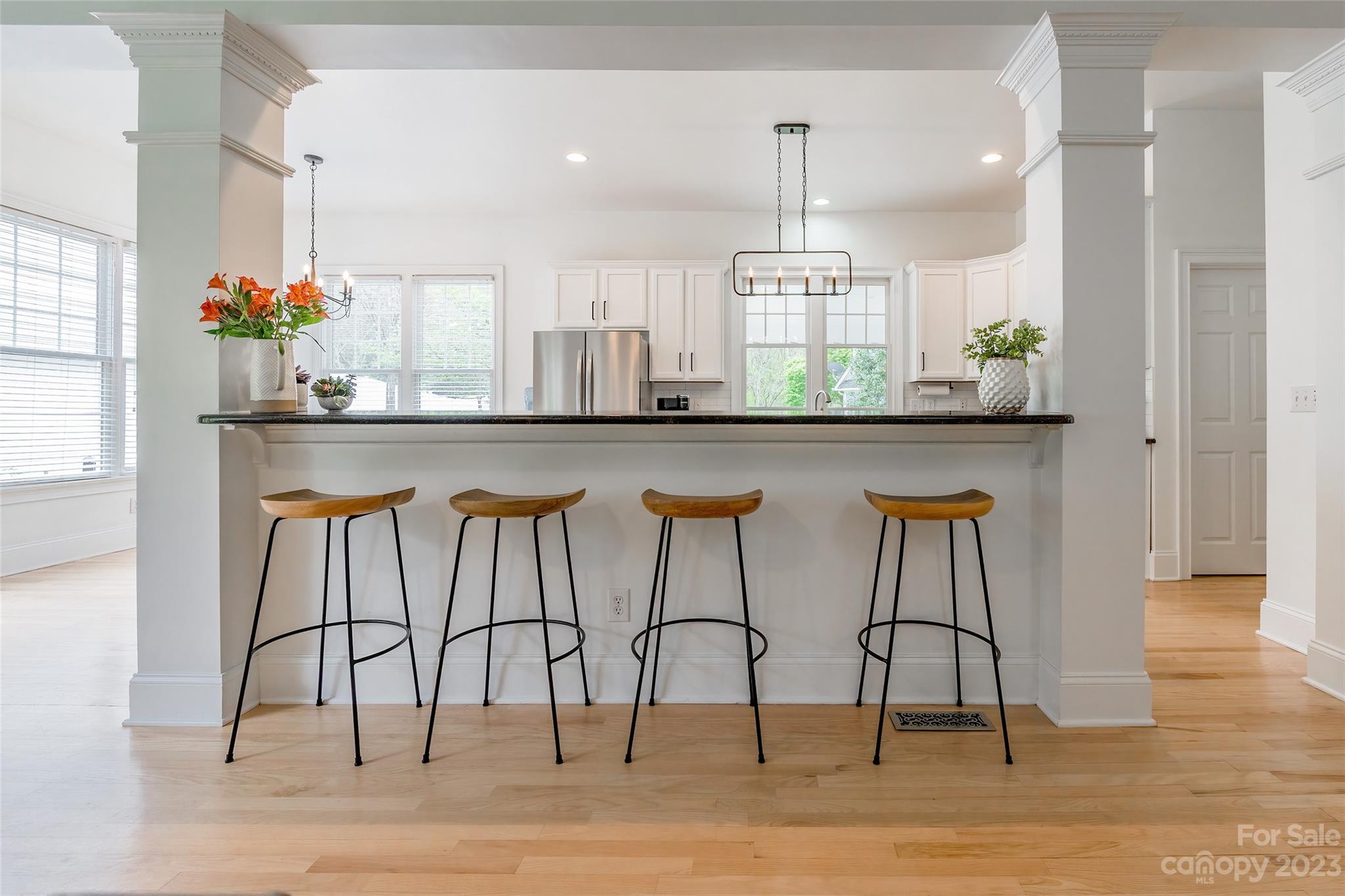 1744 Catherine Lothie Way Fort Mill, SC 29708 - Photo 13 of 44 a view of a kitchen island with furniture and wooden floor