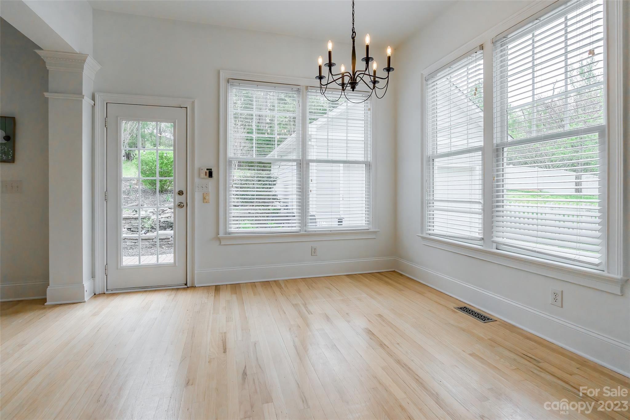1744 Catherine Lothie Way Fort Mill, SC 29708 - Photo 20 of 44 a view of an empty room with wooden floor and a window