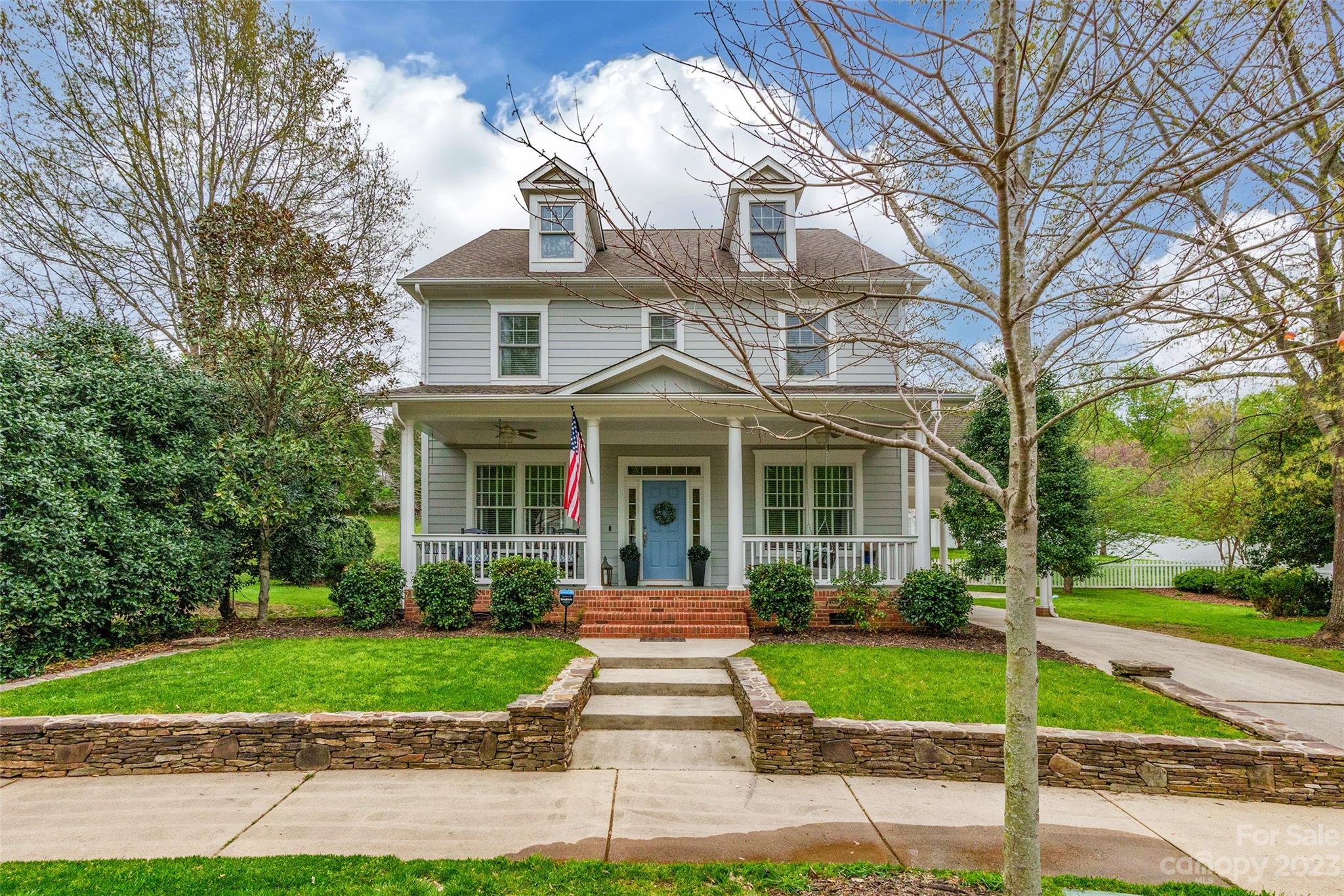 1744 Catherine Lothie Way Fort Mill, SC 29708 - Photo 2 of 44 a front view of a house with a garden and plants