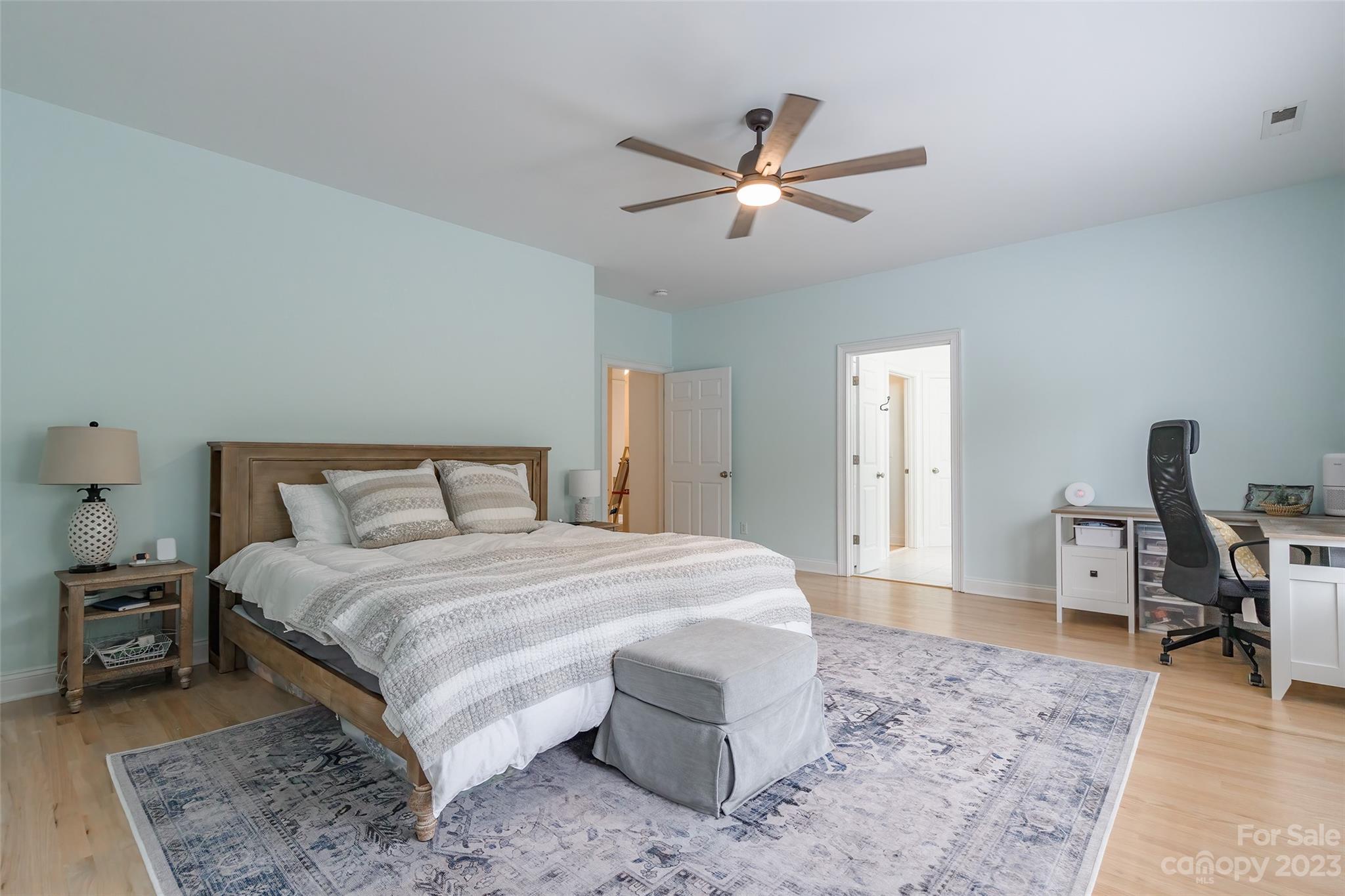 1744 Catherine Lothie Way Fort Mill, SC 29708 - Photo 22 of 44 a bedroom with a bed and a chandelier