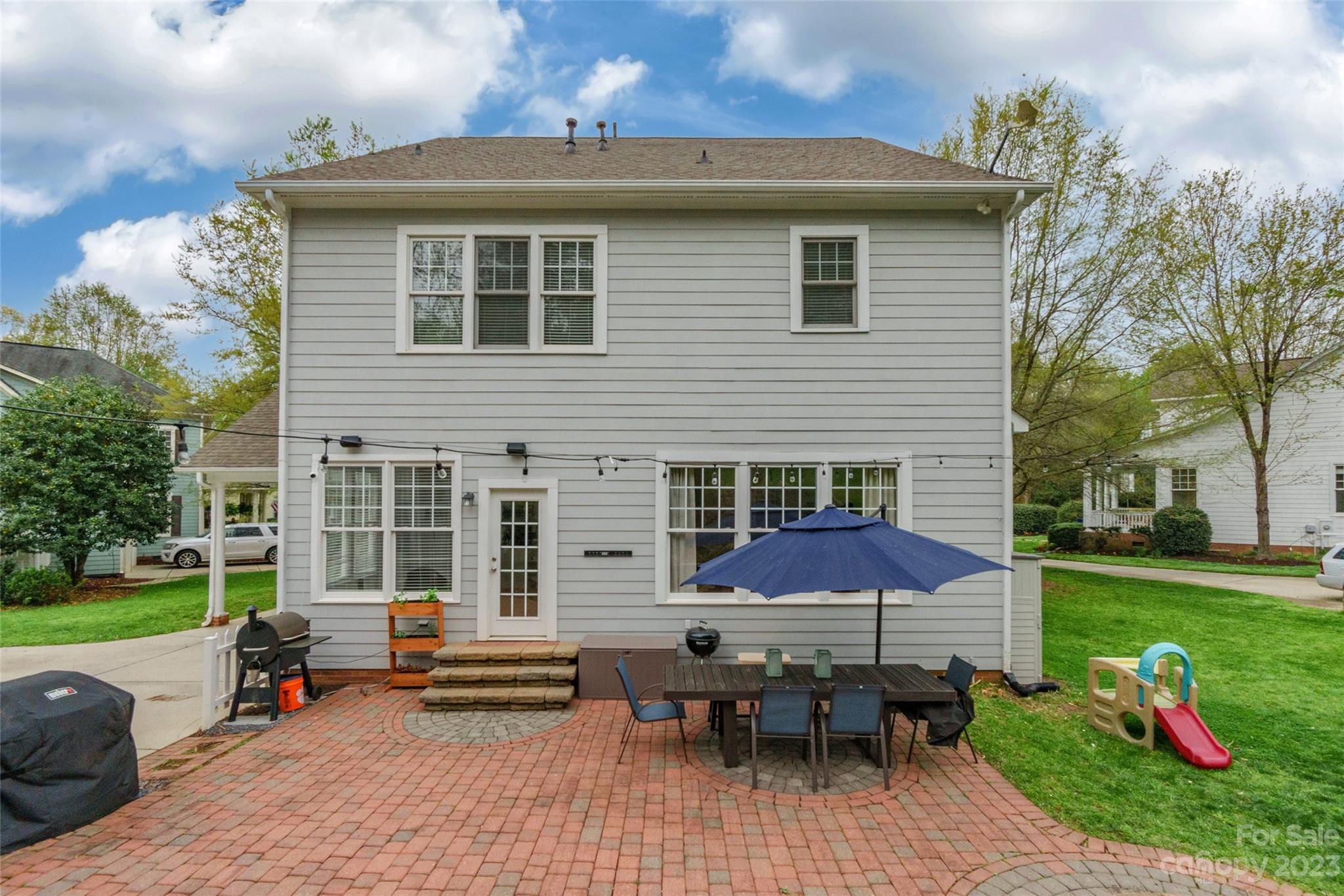 1744 Catherine Lothie Way Fort Mill, SC 29708 - Photo 40 of 44 a front view of a house with a yard table and chairs