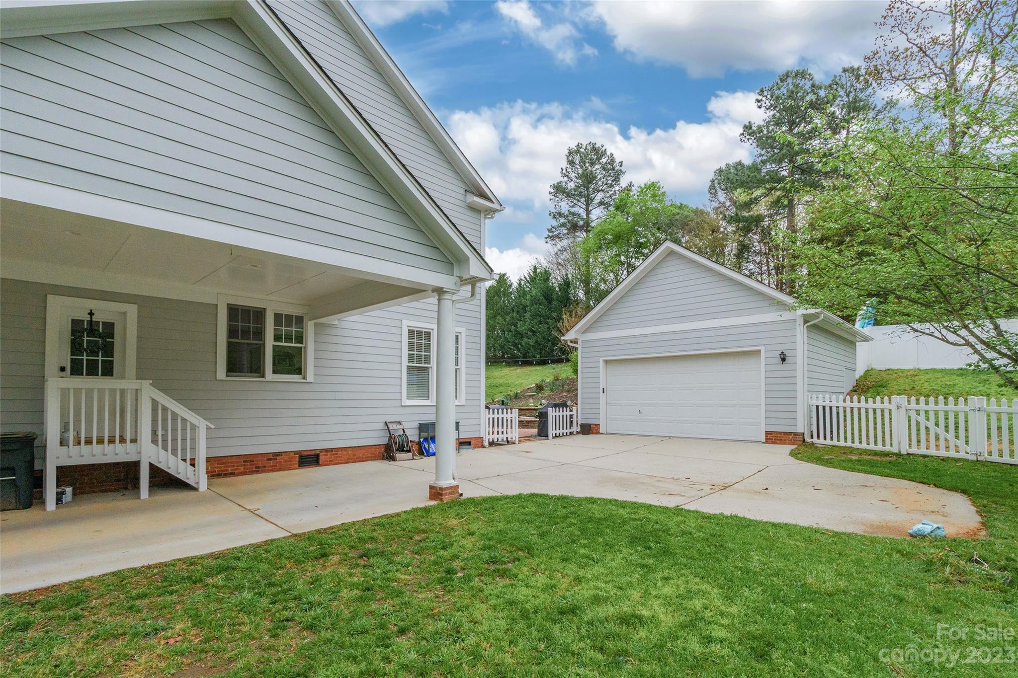 1744 Catherine Lothie Way Fort Mill, SC 29708 - Photo 42 of 44 a front view of house with yard and outdoor seating