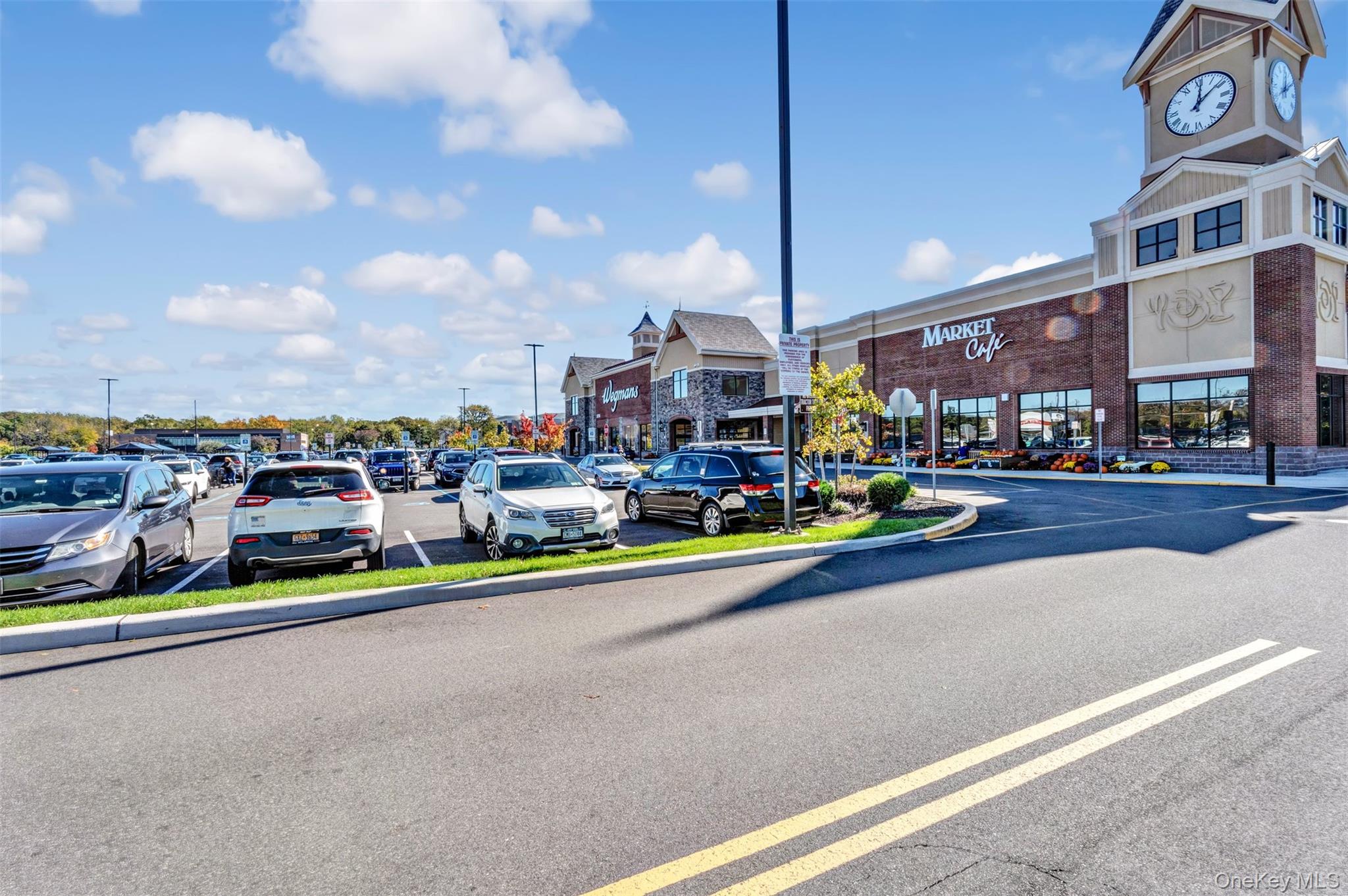 1247 Stony Brook Road Lake Grove, NY 11755 - Photo 8 of 8 a cars parked on the side of a street