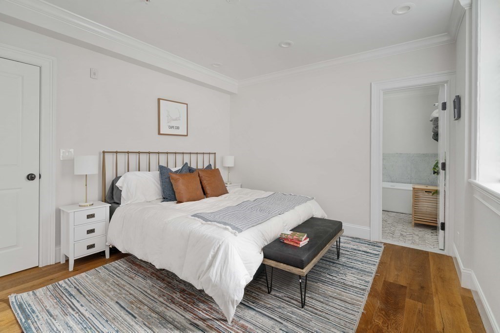 55 Addington Road, Unit 1 Brookline, MA 02445 - Photo 13 of 33 a bed room with a bed and a chair