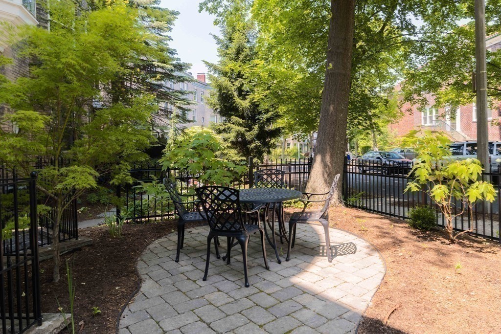 55 Addington Road, Unit 1 Brookline, MA 02445 - Photo 30 of 33 a view of a tables and chairs in patio