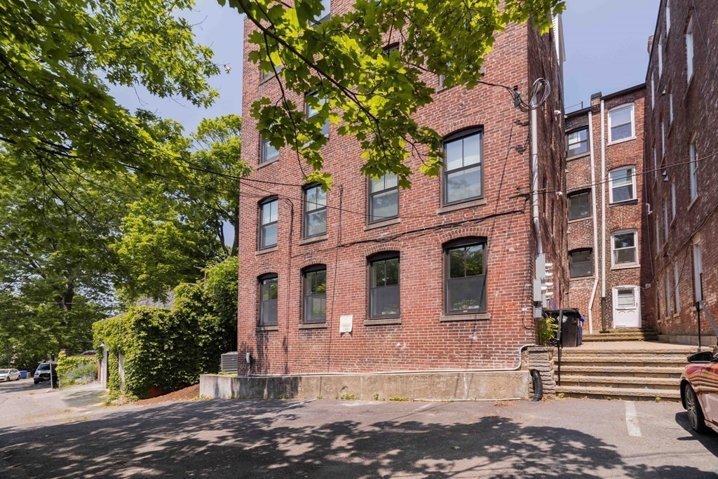 55 Addington Road, Unit 1 Brookline, MA 02445 - Photo 32 of 33 a front view of a multi story residential apartment buildings