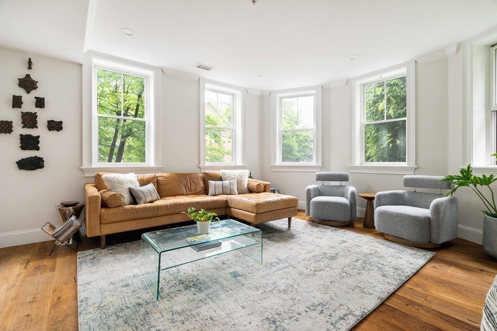 55 Addington Road, Unit 1 Brookline, MA 02445 - Photo 8 of 33 a living room with furniture and a large window