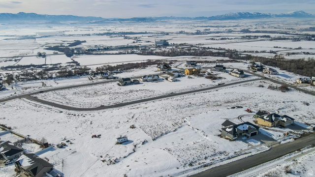 681 Cherry Ridge Lane, Unit 45 Richmond, UT 84333 - Photo 8 of 10 Snowy aerial view with a mountain view and a residential view