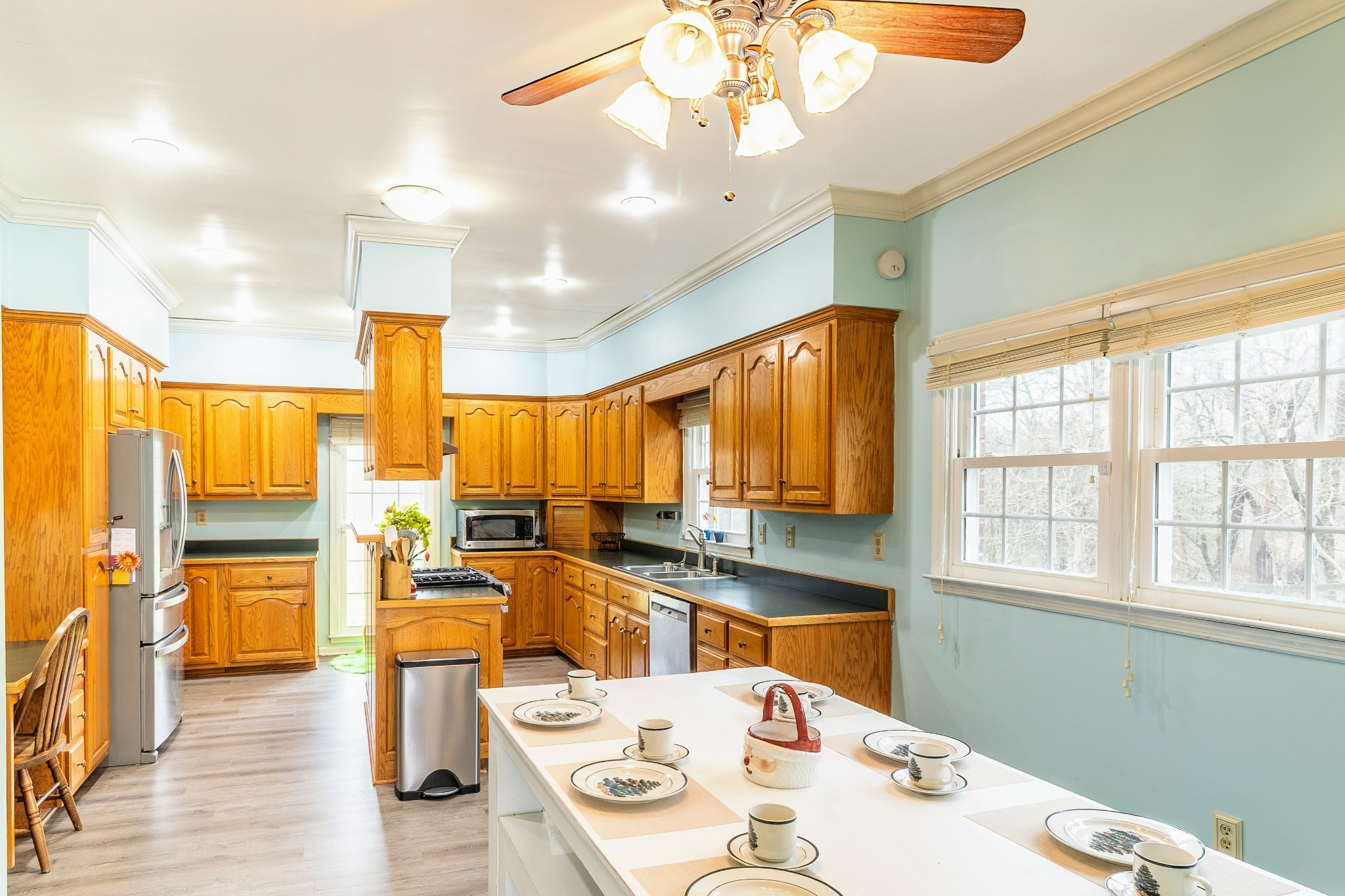 1910 Cedar Creek Road Vanleer, TN 37181 - Photo 11 of 44 a view of a dining room with furniture a chandelier and wooden floor