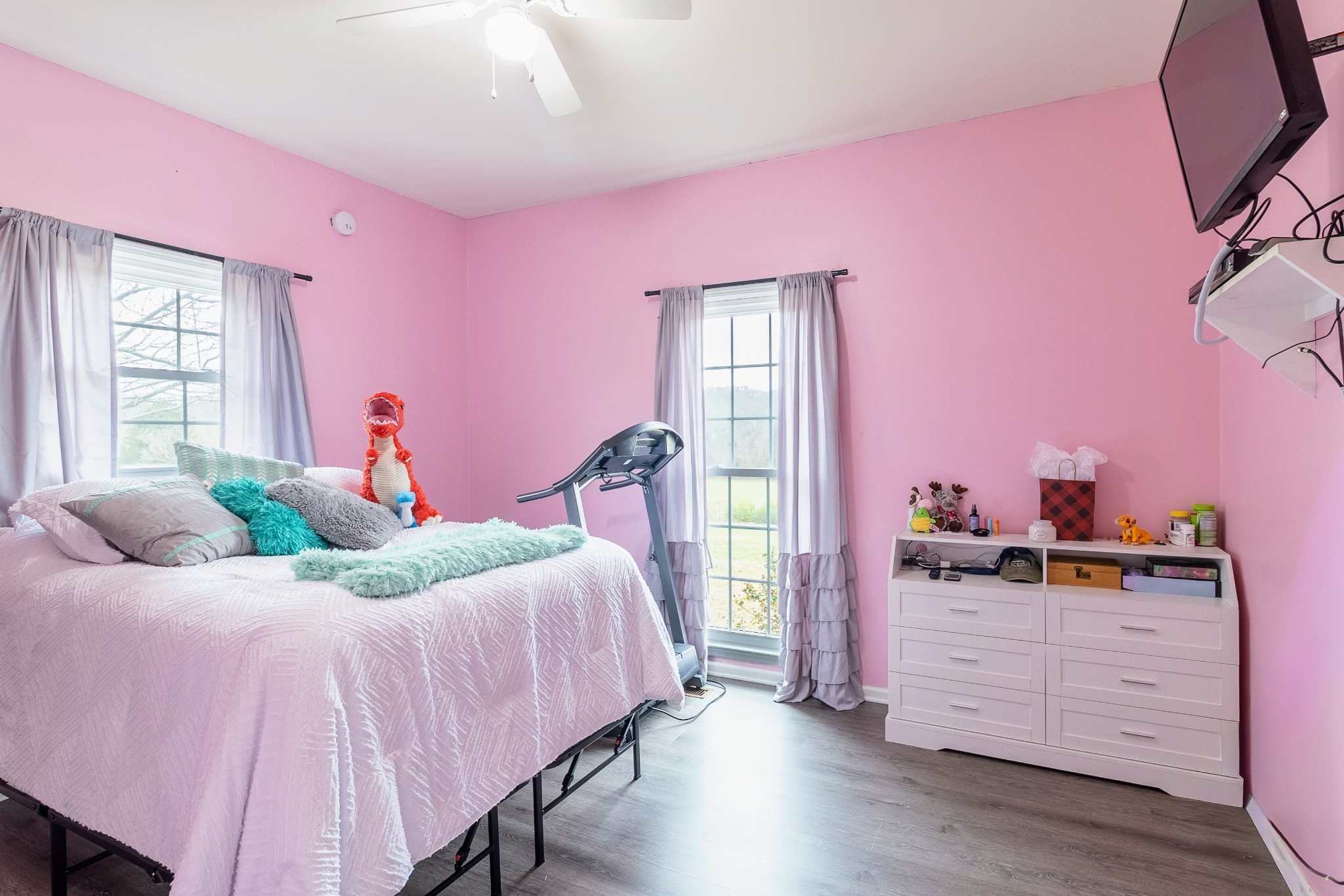 1910 Cedar Creek Road Vanleer, TN 37181 - Photo 19 of 44 a bedroom with a bed and wooden floor