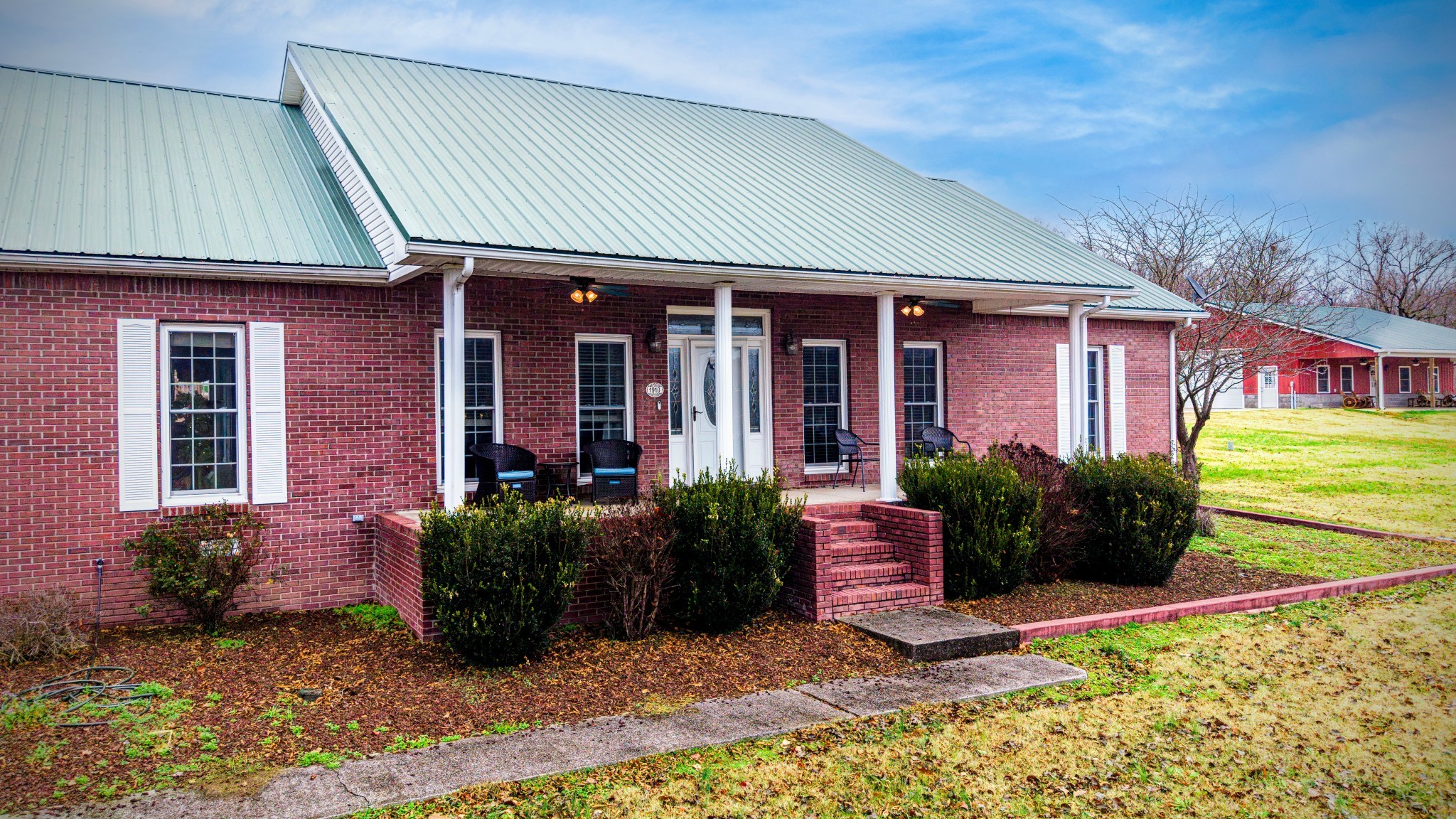 1910 Cedar Creek Road Vanleer, TN 37181 - Photo 42 of 44 a front view of a house with garden