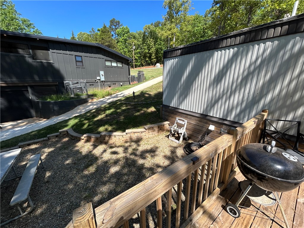 43 Sunset Cove Road Abbeville, SC 29620 - Photo 25 of 41 This property features multiple structures and a well-maintained outdoor space.