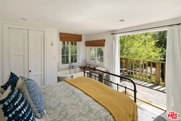 a view of balcony with small garden