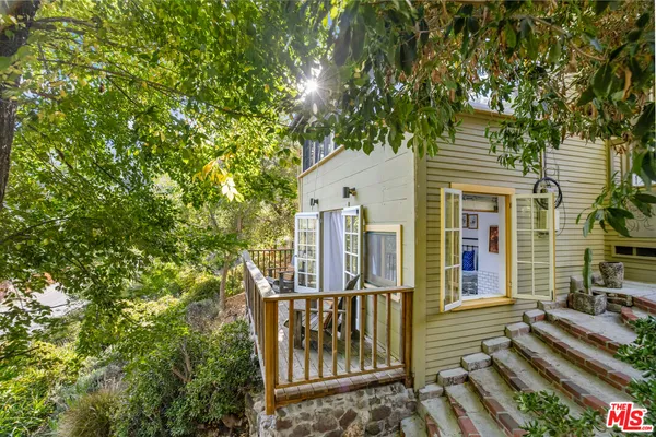 a view of a house with a bench