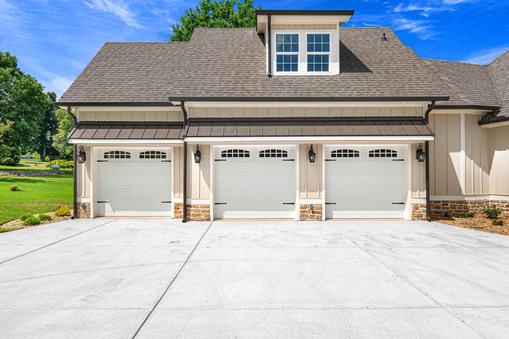 707 Vickery Street Extension Hartwell, GA 30643 - Photo 42 of 50 Three pristine garage doors enhance the inviting exterior of this charming residence.