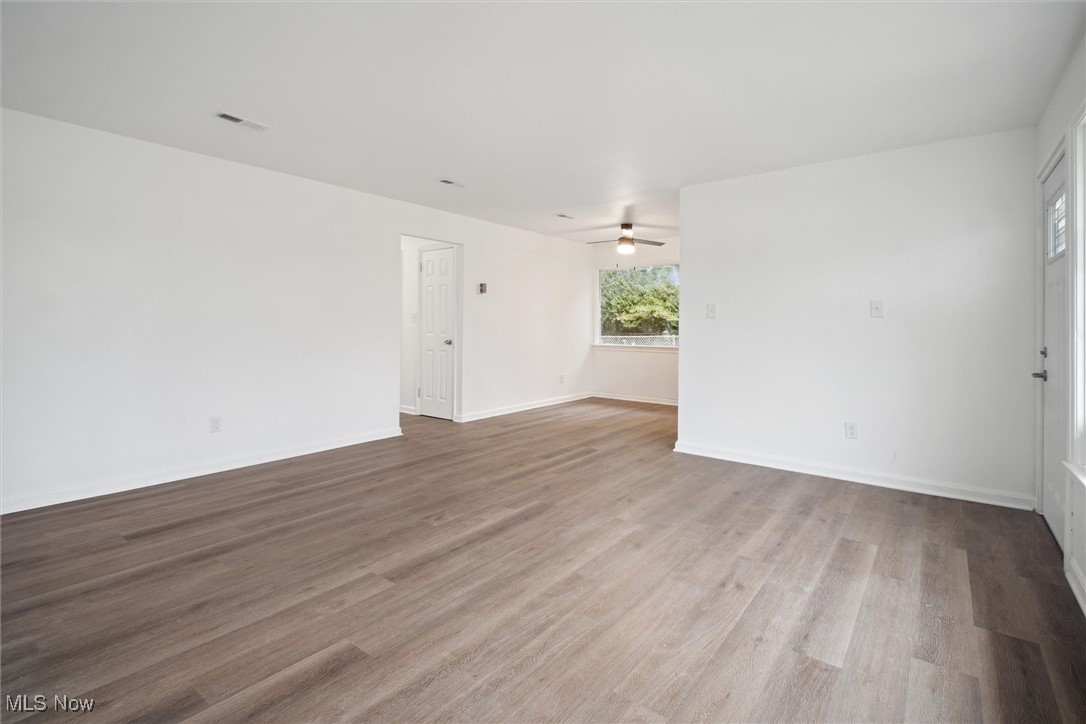 8796 West Ridgewood Drive Cleveland, OH 44130 - Photo 11 of 38 Empty room featuring light wood-type flooring and ceiling fan