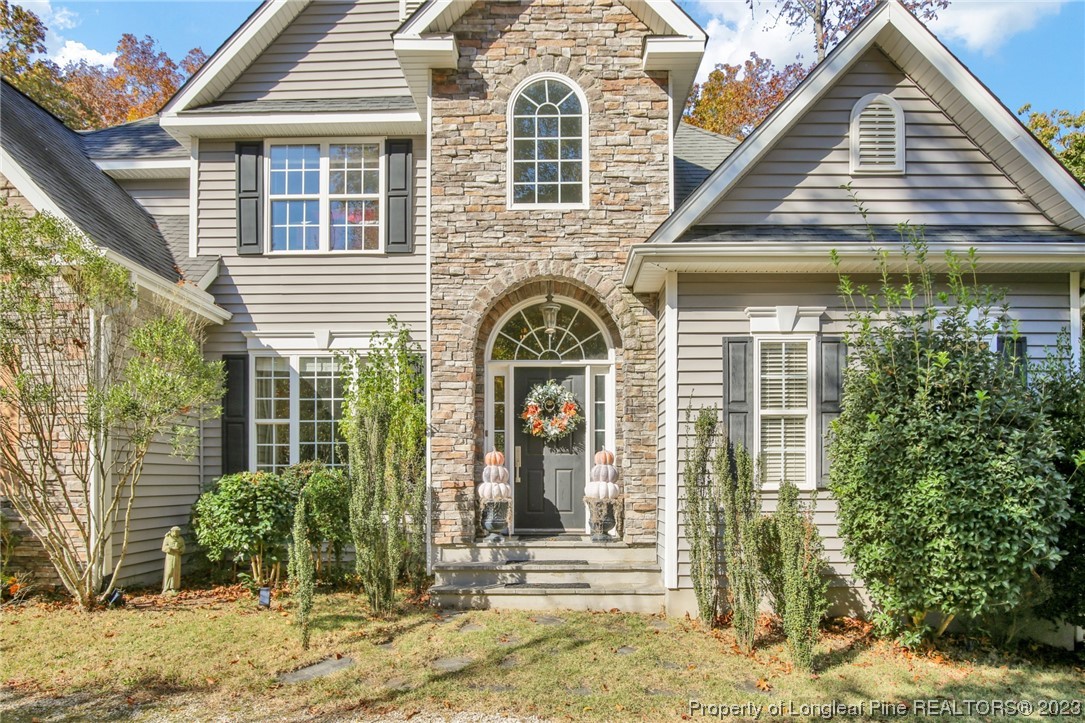 1145 Burning Tree Road Pinehurst, NC 28374 - Photo 1 of 45 a front view of a house