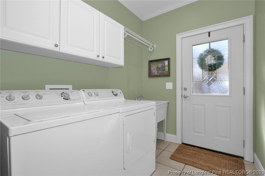 1145 Burning Tree Road Pinehurst, NC 28374 - Photo 18 of 45 a utility room with dryer and washer