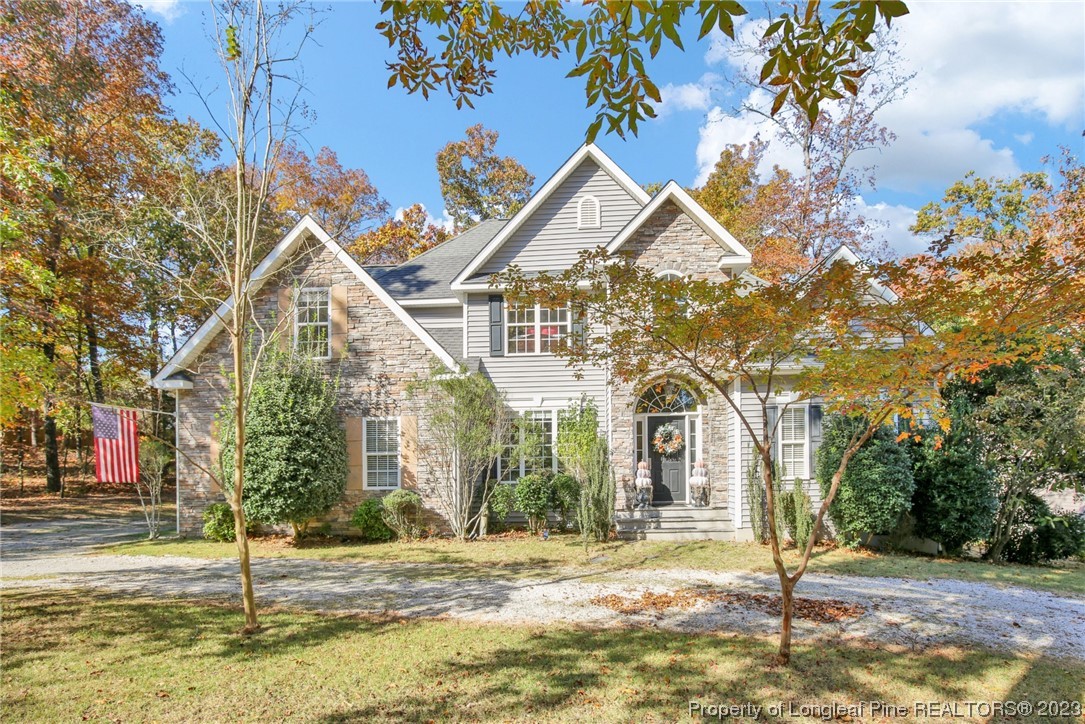 1145 Burning Tree Road Pinehurst, NC 28374 - Photo 2 of 45 a view of a house with a yard